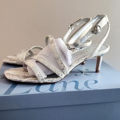 Essex Lane Womens Sandal Heels Brand New In Box -Leather Upper Adjustable Ankle Strap With Buckle Closure Square Open Toe Synthetic Lining Lightly Padded Footbed 2½" Covered Heel Synthetic Sole Silver Wedding Shoes With 4-inch Heel For Summer, Silver Wedding Shoes For Spring, Silver Ankle Strap Wedding Shoes For Spring, Silver Open-heel Wedding Shoes For Summer, Summer Wedding Shoes Silver Open Heel, Silver Open Heel Wedding Shoes For Summer, Chic Silver Wedding Shoes For Summer, Chic Silver Wedding Shoes For Spring, Silver Low Heel Medium Width Heels