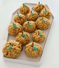 a white plate topped with cookies covered in green frosting