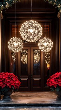 the entrance to a house decorated for christmas with lights and poinsettia plants