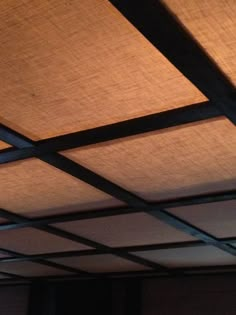 an overhead view of a ceiling with shades on it's sides and the light coming from above