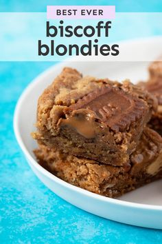 the best biscoff blondies are stacked on top of each other in a white plate