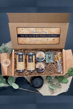 an open gift box containing soaps and body care products