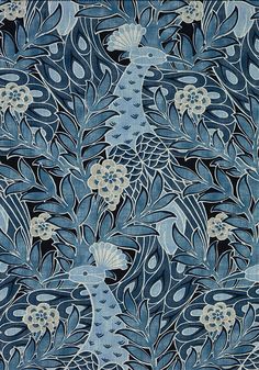 an artistic blue and white pattern with fish in the water on a black background that looks like leaves