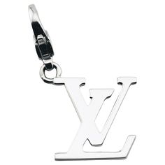 The Louis Vuitton LV Logo 18k White Gold Charm Pendant is a luxurious and iconic accessory that perfectly embodies the elegance and sophistication of the Louis Vuitton brand. Crafted from exquisite 18k white gold, this charm pendant features the instantly recognizable LV monogram, a symbol of timeless style and high fashion. The pendant showcases the interlocking LV initials in a sleek and polished design. The smooth, reflective surface of the white gold enhances the minimalist beauty of the monogram, giving it a modern, chic appeal. The cool tone of the white gold adds a touch of understated luxury, making the pendant versatile enough to complement both casual and formal attire. Designed with impeccable craftsmanship, the charm pendant captures the essence of Louis Vuitton's dedication to Louis Vuitton Charm, Louis Vuitton Pendant, Loui Vuttion Necklace, Lv Lock Necklace, Louis Vuitton Necklace Lock, Lv Logo, Minimalist Beauty, Lv Monogram, Vintage Louis Vuitton