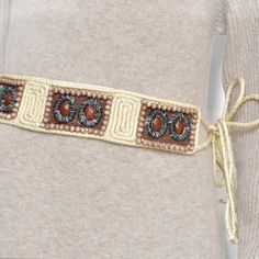 Vintage cream boho style beaded belt. Multiple types of beads and ties at each end, great for any size. 26 beaded area,2.5 inches wide 67 inches total Adjustable Brown Belts For Beach, Adjustable Bohemian Belt For Festivals, Bohemian Adjustable Belt For Festivals, Bohemian Gold Belt For Festival, Gold Bohemian Belt For Festivals, Gold Bohemian Festival Belt, Embroidered Belt For Summer Beach, Adjustable Belts For Summer Festival, Adjustable Gold Bohemian Belt