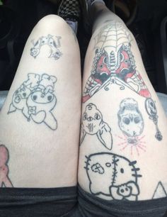 two people with tattoos on their legs sitting in a car