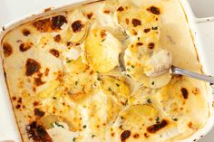 a casserole dish with potatoes and cheese