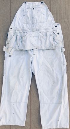 This is an authentic Sears Roebuck & co. 1950's  white  union made USA vintage bib overalls with awesome natural character  condition:  even though this one of the kind and amazing overall has some stains they  truly look awesome Made  USA waist                                   20" crutch to hem                   31" White Overalls With Pockets, Vintage White Bottoms With Pockets, White Vintage Bottoms With Pockets, White Bib Front Overalls With Pockets, White Utility Overalls With Pockets, Crutches, Bib Overalls, Union Made, Clint Eastwood