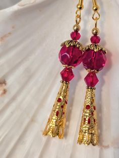 Opulent Victorian style dangle earrings!! Created using ruby red faceted glass focal beads, red faceted crystal round and bicone beads, brass filigree bead caps and bead cones, antique gold tone brass bead caps and gold plated ear wires!! Submerge yourself back into the luxe Guilded Age with these gorgeous earrings!! Length 2.75" Brass Filigree, Focal Beads, Jewellery Ideas, Earrings Red, Gold Filigree, Faceted Glass, Faceted Crystal, Brass Earrings, Focal Bead