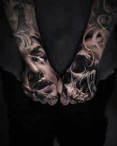 two hands that have tattoos on them, one with a skull and the other with a woman's face