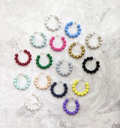 These lightweight hoops have 8mm acrylic beads and measure approximately 1.5 in. Hoops are stainless steel or are high quality gold plated. Everyday Beaded Hoop Earrings, Everyday Small Hoop Beaded Earrings With Colorful Beads, Everyday Colorful Beaded Small Hoop Earrings, Trendy Everyday Beaded Earrings, Everyday Colorful Bead Hoop Earrings, Everyday Colorful Beads Hoop Earrings, Colorful Round Bead Earrings For Everyday, Colorful Round Beads Earrings For Everyday, Trendy Small Hoop Beaded Earrings With Colorful Beads