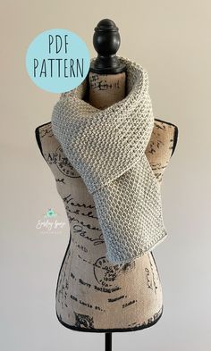 a knitted scarf on top of a mannequin headdress with the words pdf pattern above it