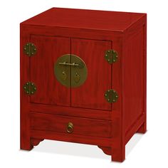 a wooden cabinet with two doors and brass hardware