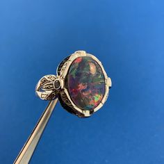 * Designer 925 Sterling Silver Opal Doublet Amethyst Blue Diamond Accented Ring * Ring size: 8.75 * Top of ring measures: 7/8" x 5/8" * Height: 3/8" * Doublet Opal measures: approximately 16.0 mm x 11.91 mm x 2.0 mm * Amethyst total carat weight: approximately .16 tcw * Blue Diamond total carat weight: approximately .03 tcw * Ring weight: 8.2 tgw * Marked: 925 * KH * THAILAND * Condition: As pictured. * S4553    Exported By ExportYourStore :) Formal Opal Open Ring, Luxury Sterling Silver Oval Opal Ring, Oval Emerald Ring With Gemstone Accents In Sterling Silver, Multi-stone Sterling Silver Opal Ring, Luxury Silver Opal Ring, Hallmarked, Luxury Silver Opal Ring Hallmarked, Silver Oval Emerald Ring With Multi-stone, Oval Silver Emerald Ring With Multi-stone, Luxury Oval Birthstone Ring In Sterling Silver