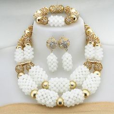 Enhance your bridal look with this classic Nigerian Wedding Bridal Jewelry. The African crystal beads jewelry set adds a touch of elegance and cultural significance to your wedding ensemble, creating a timeless and beautiful look. Traditional White Bridal Sets For Wedding, Traditional White Jewelry For Marriage, Gold Beaded Bridal Accessories For Wedding, Traditional White Polished Beads Jewelry, Traditional White Bridal Necklace For Ceremonies, Traditional Gold Beads For Wedding, Traditional Bridal Necklace With Round Beads For Marriage, Traditional White Necklace For Marriage, Traditional White Jewelry Sets For Wedding