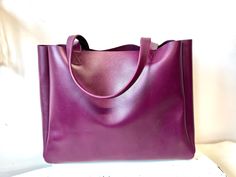 "This is our extra large grape purple leather bag, the oversized work and travel computer bag. It's supper sturdy bag made with thick firmer leather. All our bags are made to order. Production time is 3-5 business days, up to 7 days for custom orders.  Add lining to any of our bags https://www.etsy.com/listing/891051352 ❗️Measurements: ❗️ 24\" W(top opening ) x 15\"H 19\"wide base x 5\"D Strap drop 11\" Weight 3 lbs   FUNCTIONALITY: * This bag is roomy and stylish, great for your weekend getaway Purple Large Capacity Satchel For Everyday, Everyday Large Capacity Purple Satchel, Purple Large Capacity Double Handle Satchel, Modern Rectangular Purple Satchel, Modern Purple Rectangular Satchel, Square Purple Satchel For Everyday Use, Purple Square Satchel For Everyday Use, Purple Satchel Shoulder Bag For Office, Purple Square Satchel For Travel