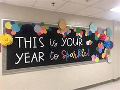 this is your year to sparkle bulletin board on the wall in an elementary school hallway