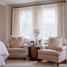 an image of a living room with two chairs