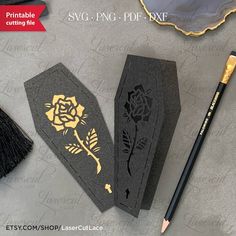 some black paper with gold designs on it and a pencil next to it that says printable cutting file svg - png - dxf