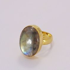 Made In India, Make the seasons greeting a memorable one with this 18k gold plated brass single oval gemstone ring. Handmade with high quality labradorite, this simple everyday ring will make Christmas a day to remember. Handmade Ring, Natural Labradorite Ring, Simple Ring, Everyday Ring, Oval Ring Gift Ideas, Spending Log, Oval Stone Ring, Stone Ideas, Beautiful Silver Rings, Ring Everyday, Single Stone Ring, Bezel Set Ring, Everyday Ring