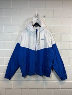 Vintage Nike Size XXL Shelljacket Sportsjacket Windbreaker Hoodie 90s Y2K Vintage sports jacket from Nike in size XXL, one side pocket with zipper on the right and left, Color: blue white Defects : none Dimensions: Length 73cm Width 69cm Arm length from collar 88 cm If you have any questions, just write to me :) Athleisure Hooded Windbreaker For Streetwear, Hooded Windbreaker For Streetwear, Athleisure Hooded Jacket With Pockets For Streetwear, Hooded Athleisure Jacket With Pockets For Streetwear, Sportswear Windbreaker With Drawstring Hood And Long Sleeves, Nylon Hooded Windbreaker For Sports Season, Hooded Nylon Windbreaker For Sports Season, Hooded Athleisure Outerwear For Streetwear, Hooded Nylon Track Jacket For Sports Season