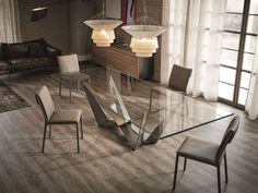 a glass dining table with chairs around it