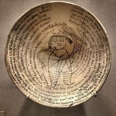 an ancient bowl with writing on it