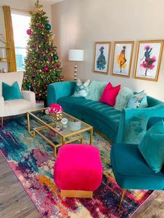 a living room filled with furniture and a christmas tree in the corner on top of a rug