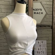 Nwt Casual Twist Tee Is An Absolute Must Have! This Cross Front Highneck Sleeveless Tank Can Easily Be Dressed Up Or Dressed Down. It Is So Comfortable And Should Be On Everyones Clothing Rack! Stretchy 92% Nylon, 8% Spandex Comes In White & Black One Size Fits All Clothing Rack, Online Boutiques, Dressed Down, Sleeveless Tank, One Size Fits All, White Black, White And Black, High Neck, Long Sleeve Blouse