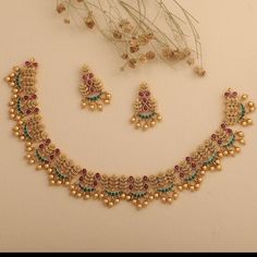 a necklace and earring set with pearls