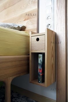 a bed with a wooden headboard and night stand