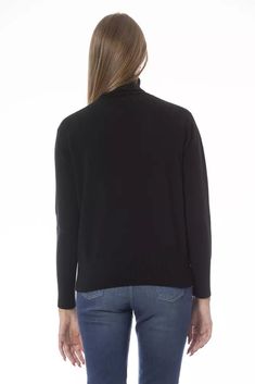 Drape yourself in the epitome of timeless elegance with the Baldinini Trend Turtleneck Sweater. The perfect amalgamation of luxurious comfort and sleek design, this piece boasts a snug turtleneck and long sleeves with finely ribbed cuffs that offer both style and warmth. Handcrafted from a sumptuous blend of 50% wool and 50% cashmere, its superior quality is palpable to the touch. Featuring a discrete yet distinguished metal monogram that whispers high-fashion, this black sweater is an essential Cashmere Sweater Women, Cashmere Color, Sneaker Jewelry, Women Sweater, Seychelles, Knit Cuff, Sophisticated Style, Black Wool, Boot Shoes Women