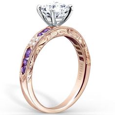 a yellow gold engagement ring with purple and white stones