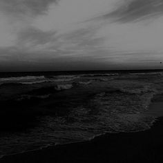 a black and white photo of the ocean