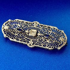 * Victorian Edwardian 10K White Gold Sapphire Diamond Filigree Bar Pin Brooch * Length: 3/4" * Width: 1-3/4" * Sapphire marquise measure: approximately 4.5 mm x 2.0 mm each * Diamond measures: approximately 2.25 mm * Weight: 3.9 tgw * Marked: 10K * Condition: Great * G741    Exported By ExportYourStore :) Ornate Yellow Gold Brooch For Formal Occasions, Antique Filigree Brooch For Formal Occasions, Antique Filigree Brooches For Formal Occasions, Ornate Brooches With Intricate Design For Formal Occasions, Heirloom Engraved Brooch For Wedding, Heirloom Engraved Brooches For Wedding, Classic White Gold Brooch For Formal Occasions, Classic White Gold Brooches For Evening, Yellow Gold Filigree Brooches For Wedding