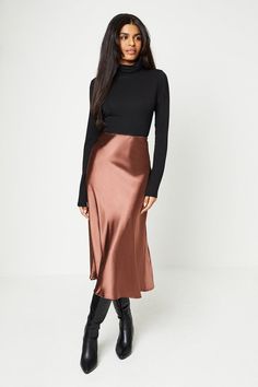 From everyday midis to flirty minis, in a wide range of fabrics and prints, our skirts will flatter every silhouette. Think printed satin, black leather and monochrome tweed; whatever you're looking for, our skirt edit has all the best styles. Style: Petite Plain Satin Bias Midi Skirt.  Ideal for: Daywear.  Design: Split.  Made in the UK.  Model wears size UK 10 and is 5' 3" tall. Silk Midi Skirt Outfit, Satin Midi Skirt Outfits, Slip Skirt Outfit, Silk Skirt Outfit, Satin Slip Skirt, Chique Outfit