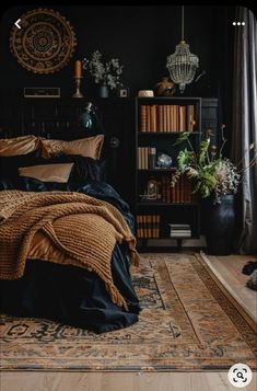 a bed room with a neatly made bed next to a book shelf and bookshelf