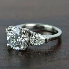 three stone engagement ring with pear shaped diamonds