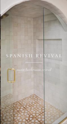 a bathroom with a glass shower door and tile flooring that says spanish revival main bathroom reveal