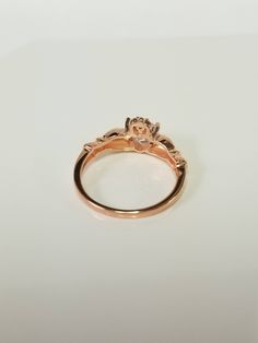 "Thanks for shopping our vintage estate store. We tend to sell well below wholesale and truly hope you enjoy all of our items. Many of the items are one of a kind, so please enjoy scrolling through the pictures and hopefully something will catch your eye. Brown spots are from the camera. Estate nice rose gold over sterling silver 925 heart cz 1/2ct diamond Irish Claddagh ring and one small cz diamond in top of crown. Color is more true on the novel book. Ring size: please select a size Setting: Classic Rose Gold Flower Ring For Anniversary, Classic Rose Design Jewelry For Anniversary, Rose Gold Hallmarked Diamond Promise Ring, Rose Gold Anniversary Rings With Hallmark, Dainty Gold Claddagh Ring, Ruby Claddagh Ring, Rose Gold Claddagh Ring, Diamond Claddagh Ring, Silver Claddagh Ring