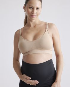 Why yes, it is possible to love your nursing bra this much. Made with a blend of recycled nylon and spandex, the seamless bra includes knit-in support zones around the cups to provide lift without a single wire. Designed with adjustable straps and a bra extender to keep you comfortable throughout pregnancy and postpartum. It also comes with all the nursing essentials like removable pads and clips. The perfect everyday bra, providing you with the full coverage support you need.  | Quince | Women' Seamless Fitted Nursing Bra For Maternity, Supportive Fitted Seamless Nursing Bra, Supportive Full Coverage Nursing Bra, Seamless Full Coverage Nursing Bra For Maternity Wear, Supportive Nursing Bra With Removable Pads, Supportive Seamless Full Coverage Nursing Bra, Supportive Nursing Bra With Light Support, Nursing Sports Bra, Pregnant Model