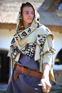 a young man dressed in medieval clothing