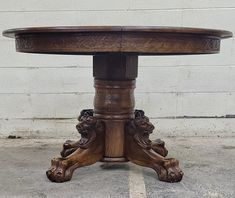 a wooden table sitting on top of a cement floor