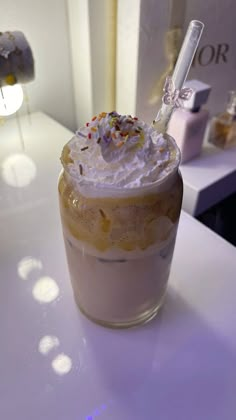 there is a drink with whipped cream and sprinkles