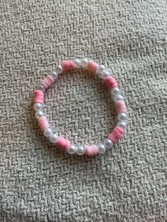 Handmade bracelet with pink clay beads and faux pearls Adjustable Pink Pearl Bracelet With Spacer Beads, Handmade Pink Pearl Bracelet, Pink Pearl Bracelet With Letter Beads, Pink Beaded Pearl Bracelet With Round Beads, Pink Pearl Beaded Bracelets For Jewelry Making, Pink Beaded Round Pearl Bracelet, Pink Beaded Pearl Bracelet, Casual Pink Beaded Pearl Bracelet, Pink Round Beaded Bracelets With Spacer Beads