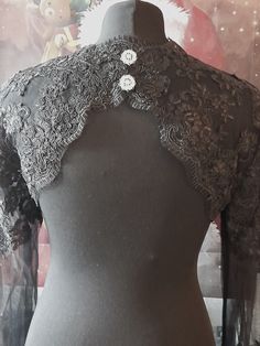 Beautiful longsleeve bolero shrug which is made from an high quality lace fabric. This cute little bolero features wide trumpet sleeves,beautiful keyhole back and it has an open front. High quality. Size: S,M,L,XL,XXL 100% handmade Colour: black,white and ivory -------------------- International Shoppers: Please send me a message with your location for details about shipping costs as there are faster deliveries available. Add our shop to your Favorites to get the unique coupon codes and discounts! Fitted Long Sleeve Lace For Party, Fitted Lace Shrug With Lace Trim, Party Lace Shrug With Lace Sleeves, Party Shrug With Lace Trim, Long Sleeve Lace Shrug For Party, Fitted Evening Shrug With Lace Sleeves, Evening Fitted Shrug With Lace Sleeves, Long Sleeve Lace Top With Lace Collar For Wedding, Lace Shrug With Lace Trim For Wedding