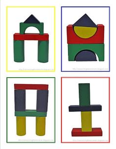 four blocks with different shapes and colors on them, each one has a building in the middle