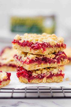 raspberry crumb bars stacked on top of each other