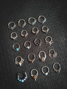 Collection of Silver 925 Septums / Helix with stones A1 = White Opal A2 = Onyx A3 = Turquoise A4 = Opal Doublet B1 = Moonstone B2 = Garnet B3 = Amethyst B4 = Labradorite C1 = Turquoise C2 = White Opal C3 = Onyx C4 = Swarovski Crystal D1 = Labradorite D2 = Smokin Quartz D3 = Labradorite D4 = Coraline Orange E1 = White Opal x5 E2 = Orange Coraline E3 = White Opal E4 = Smokin Quartz Boho Jewels, Alternative Jewelry, Nose Ring Stud, Body Jewellery, White Opal, Helix, Swarovski Crystal, Body Jewelry, Silver 925