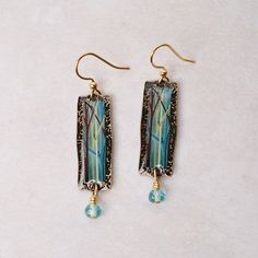 These light and lovely earrings are created using silver, bronze, or copper plated brass with Czech or Swarovski crystals. Ear wires are surgical steel or gold or silver plated surgical steel. 2" Long Handcrafted in the USA Green Earrings, Lovely Earrings, Copper Plated, Ear Wires, Swarovski Crystals, Silver Plate, Silver Plated, Blue Green, Multi Color